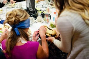 A blindfolded guest is served bread at a previous Dinner in the Dark event.