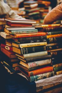 Photo of second-hand, hard cover books by Dewang Gupta on Unsplash