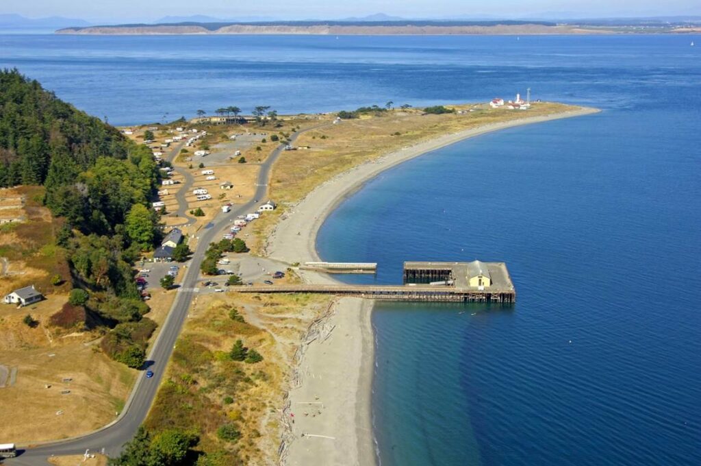 An arial view of the marine science center, showing the building on the water, connected to the shore by a dock.