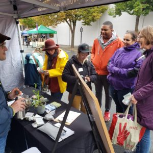 People gathered around a booth