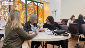 A group of people sitting at a table